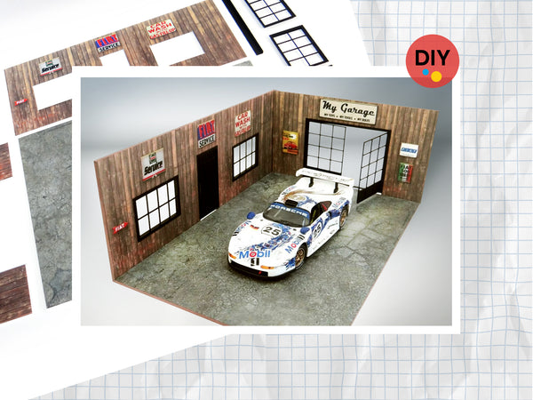 A diorama model kit of a wooden garage at a 1:18 scale, with a white die-cast car displayed inside. The kit includes walls, windows, doors, and a parking base, all arranged for assembly.