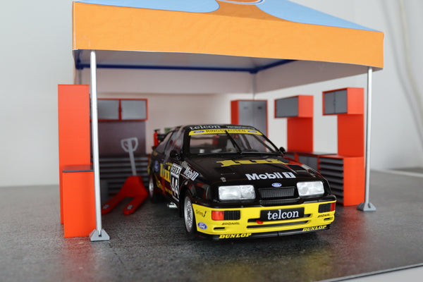 Detailed orange and grey scale model garage furniture for collectors