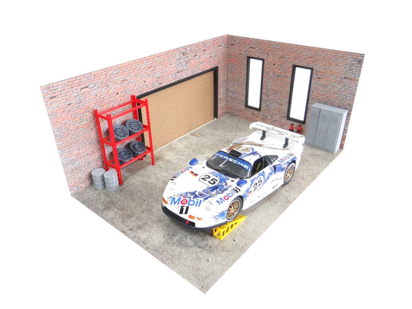 Model car in a garage with a brick wall and red shelf.