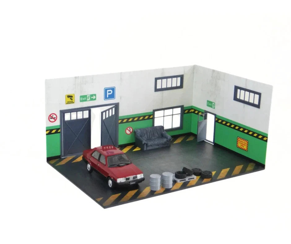 Front view of 1:43 scale auto garage diorama with open doors

