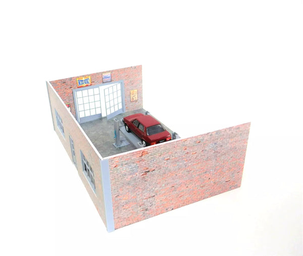 Model of a small building with a red car inside on a white background
