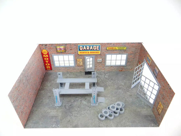 1:43 scale parts and service garage diorama with car lift, brick walls, and tire stack