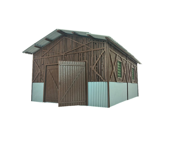 Model of a wooden shed with a green roof on a white background