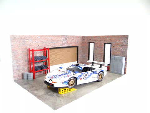 Model car in a garage with a brick wall and shelves.