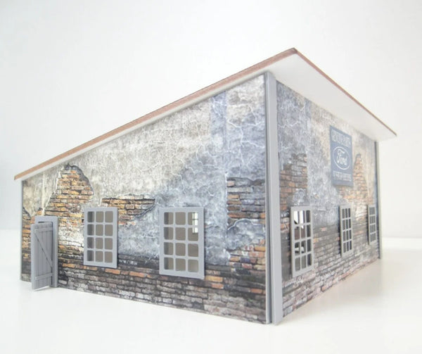 Model of a building with stone facade and Ford logo on a white background