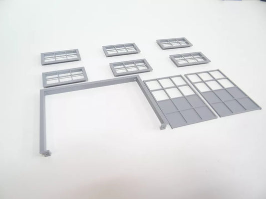 A set of gray miniature model doors and windows for a 1:24 scale diorama, displayed on a white background.