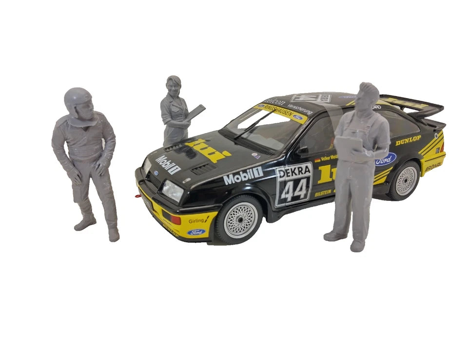 three gray figures on a white background
