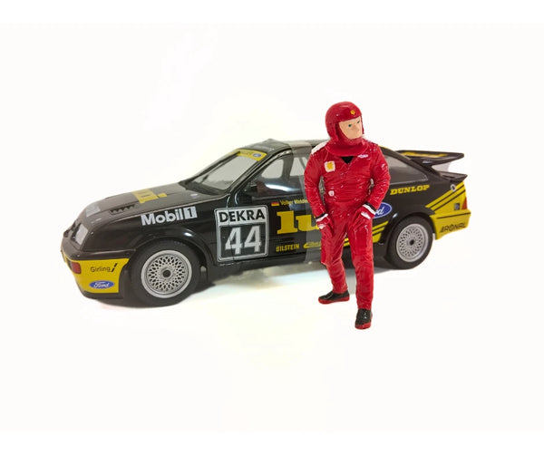 Model car with racing livery and a figure in a red racing suit on a white background